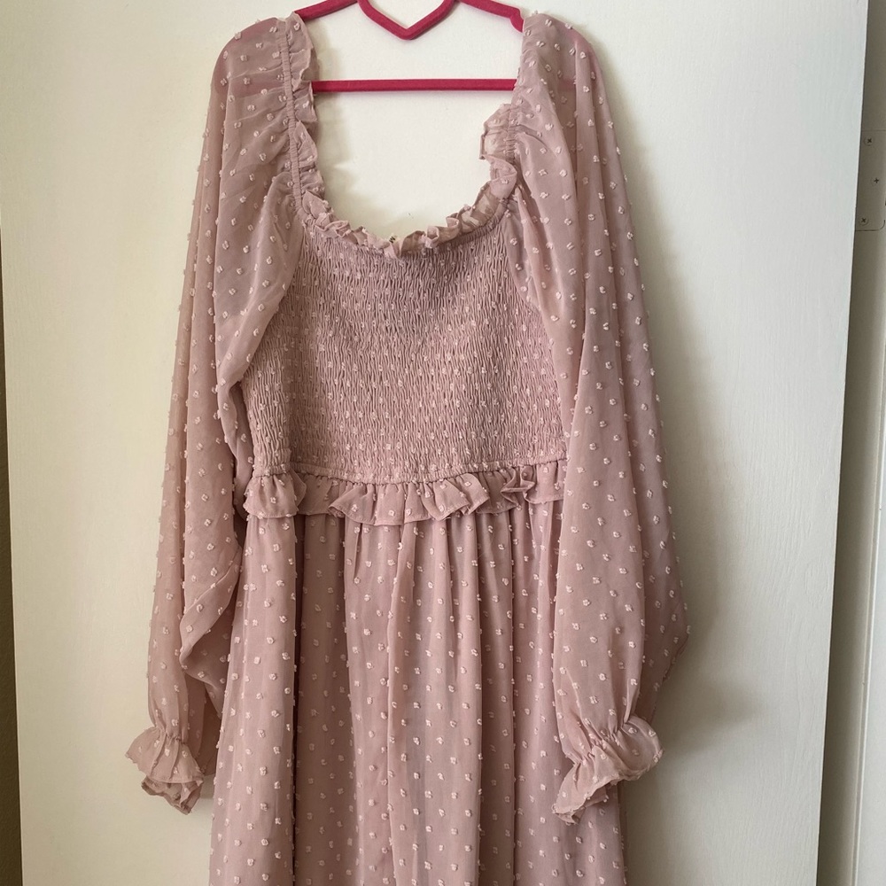 mauve puff sleeve dress with smocked top. great condition. never worn. has tags